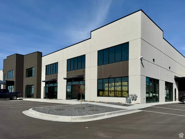 View of property with uncovered parking