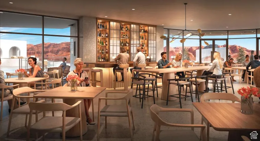 Dining space with a wall of windows and a mountain view
