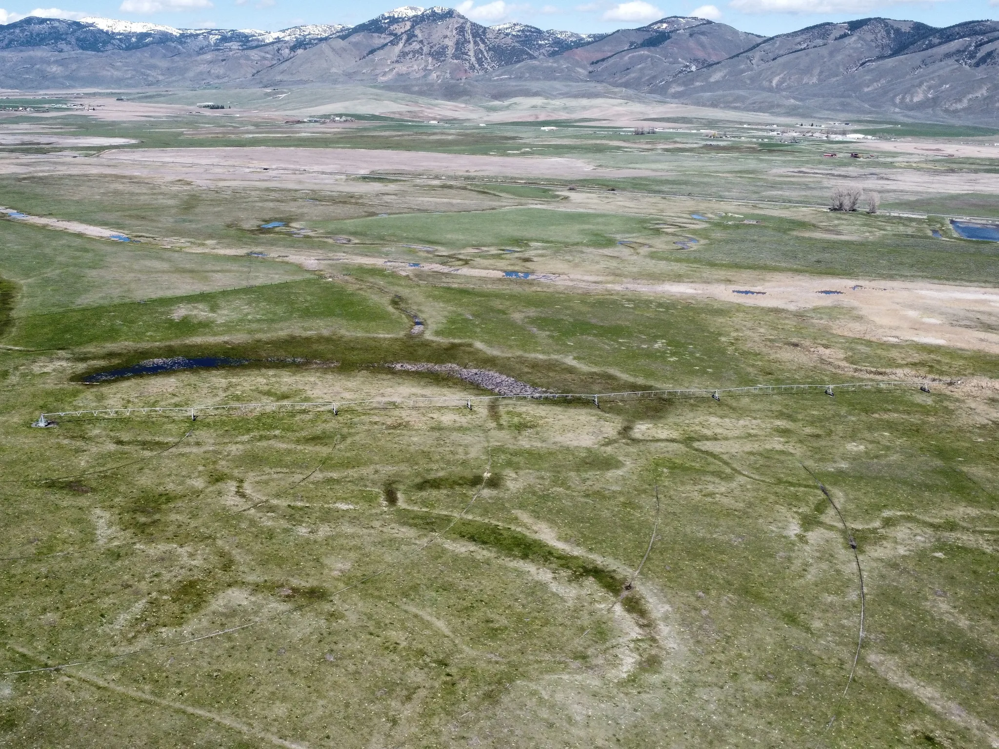 View of mountain backdrop with rural landscape