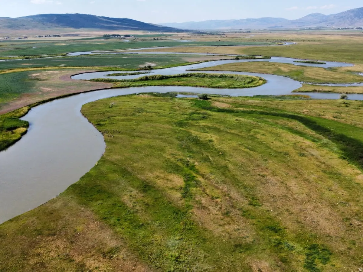 View of property location with a water and mountain view