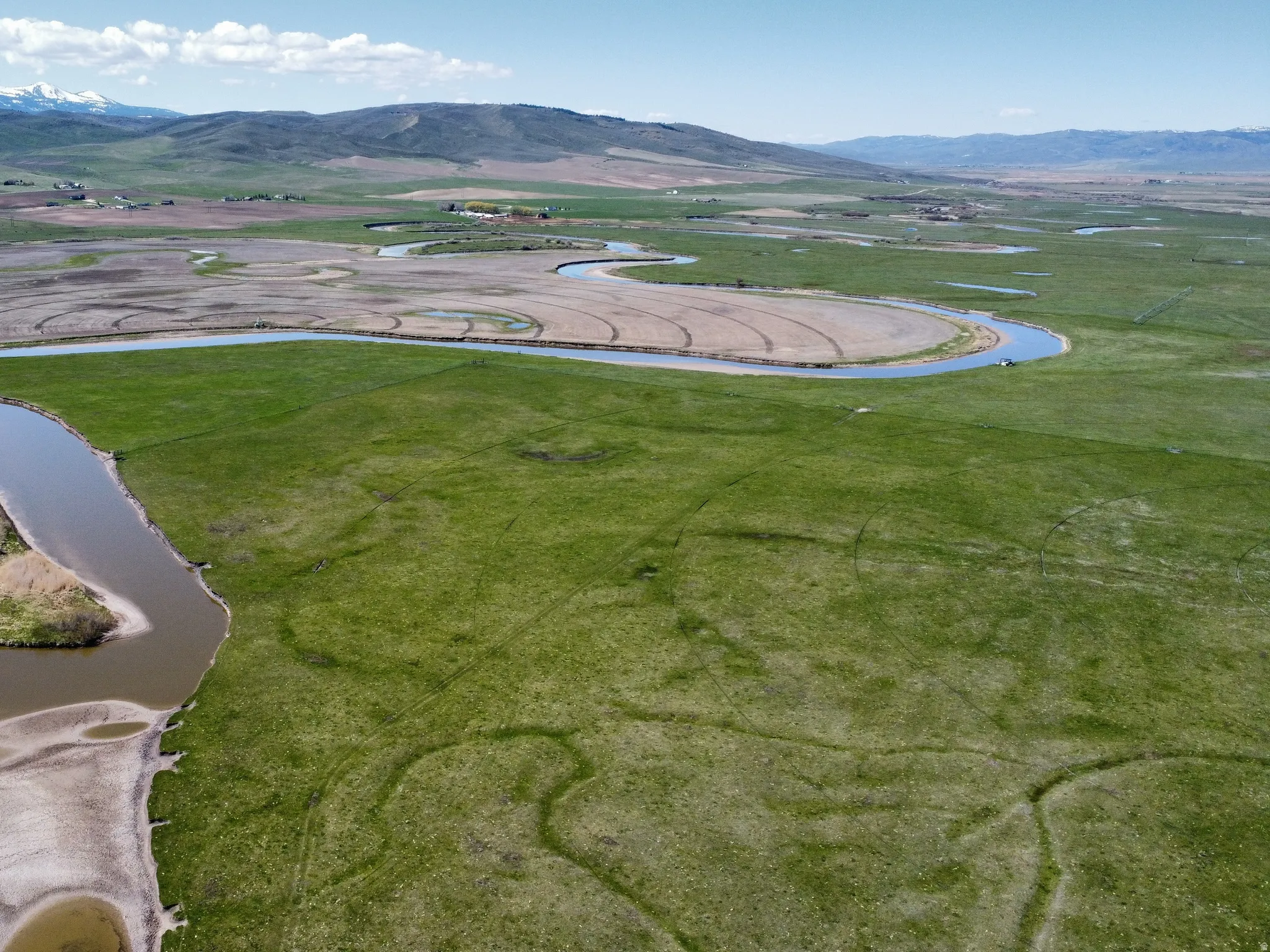 Aerial view of property's location with a water and mountain view