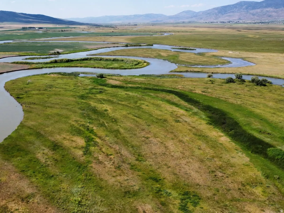View of property location with a water and mountain view