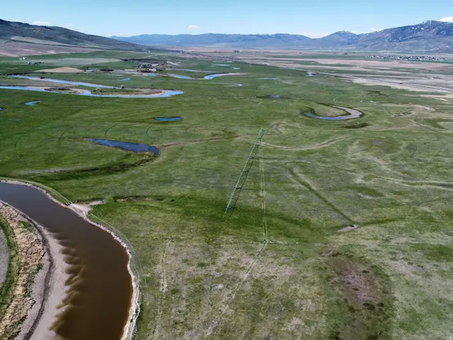 View of property location featuring a water and mountain view