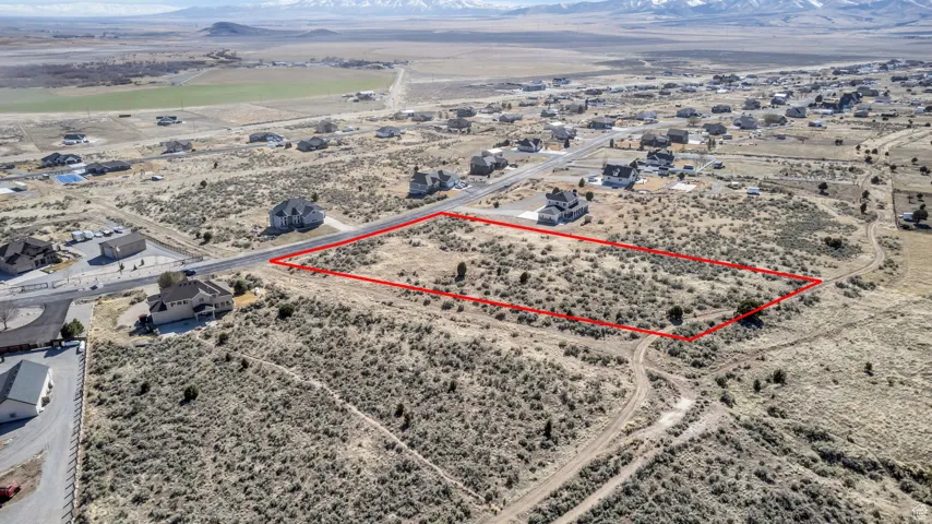 Birds eye view of property featuring a rural view and view of desert