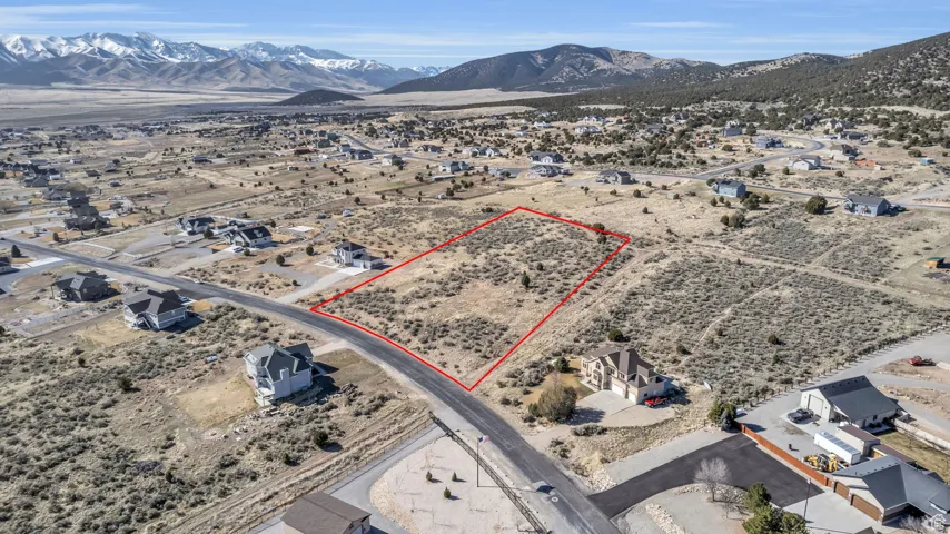 Drone / aerial view featuring view of desert and a mountain view