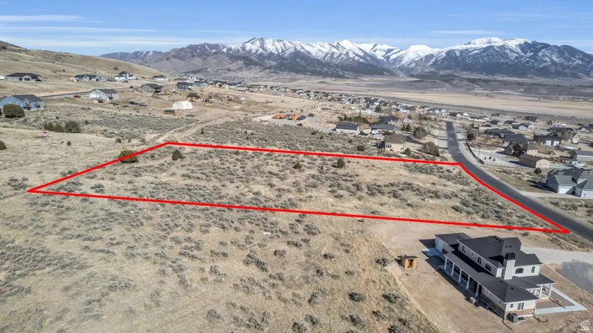 Birds eye view of property with a mountain view and view of desert