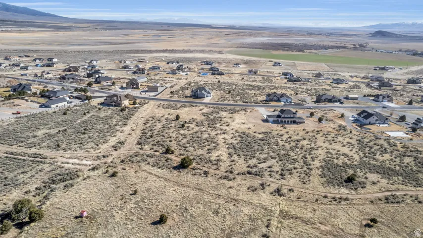 Birds eye view of property with a mountain view and view of desert