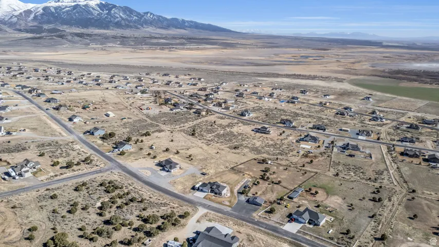 Drone / aerial view with view of desert and a mountain view