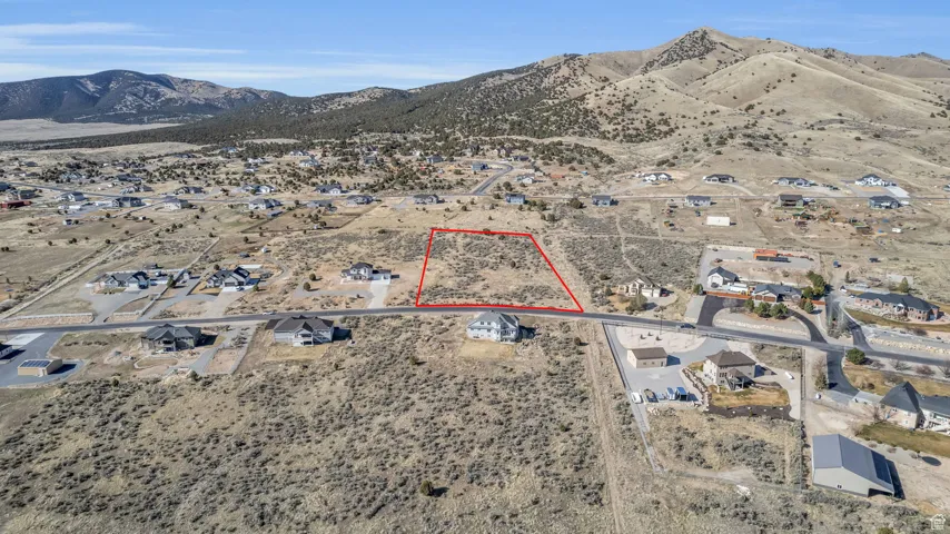 Drone / aerial view featuring view of desert and a mountain view