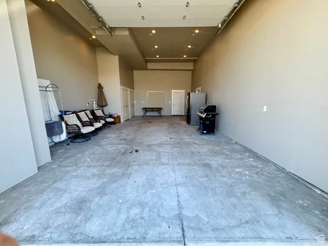 Garage with freestanding refrigerator