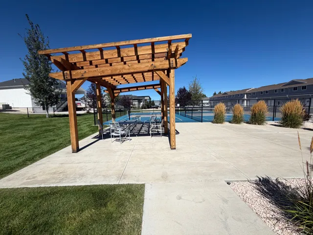 Wood pergola over a concrete patio