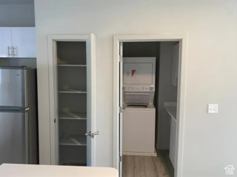 Interior space featuring stacked washer / drying machine