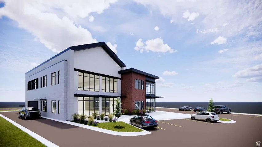 View of building exterior featuring uncovered parking