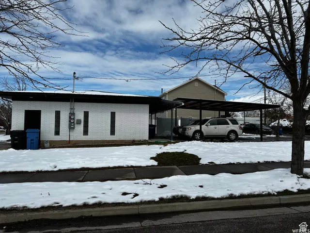Exterior space featuring a carport