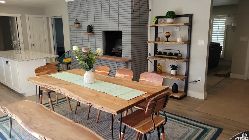 Dining room with light wood finished floors and baseboards