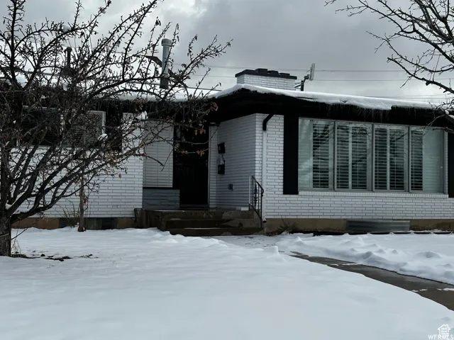 View of front of property featuring brick siding