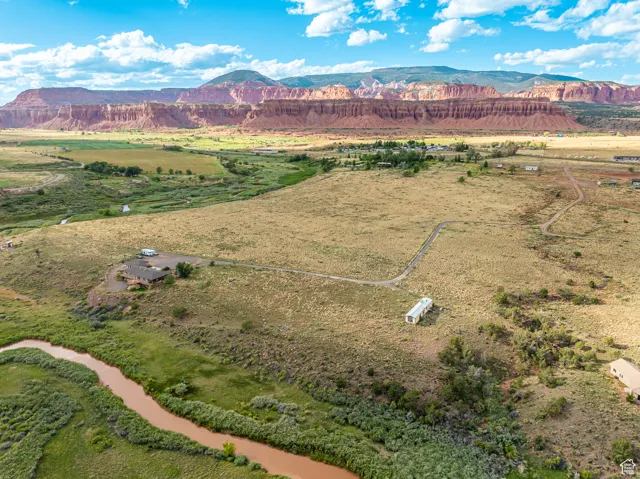 Birds eye view of property with a mountain view