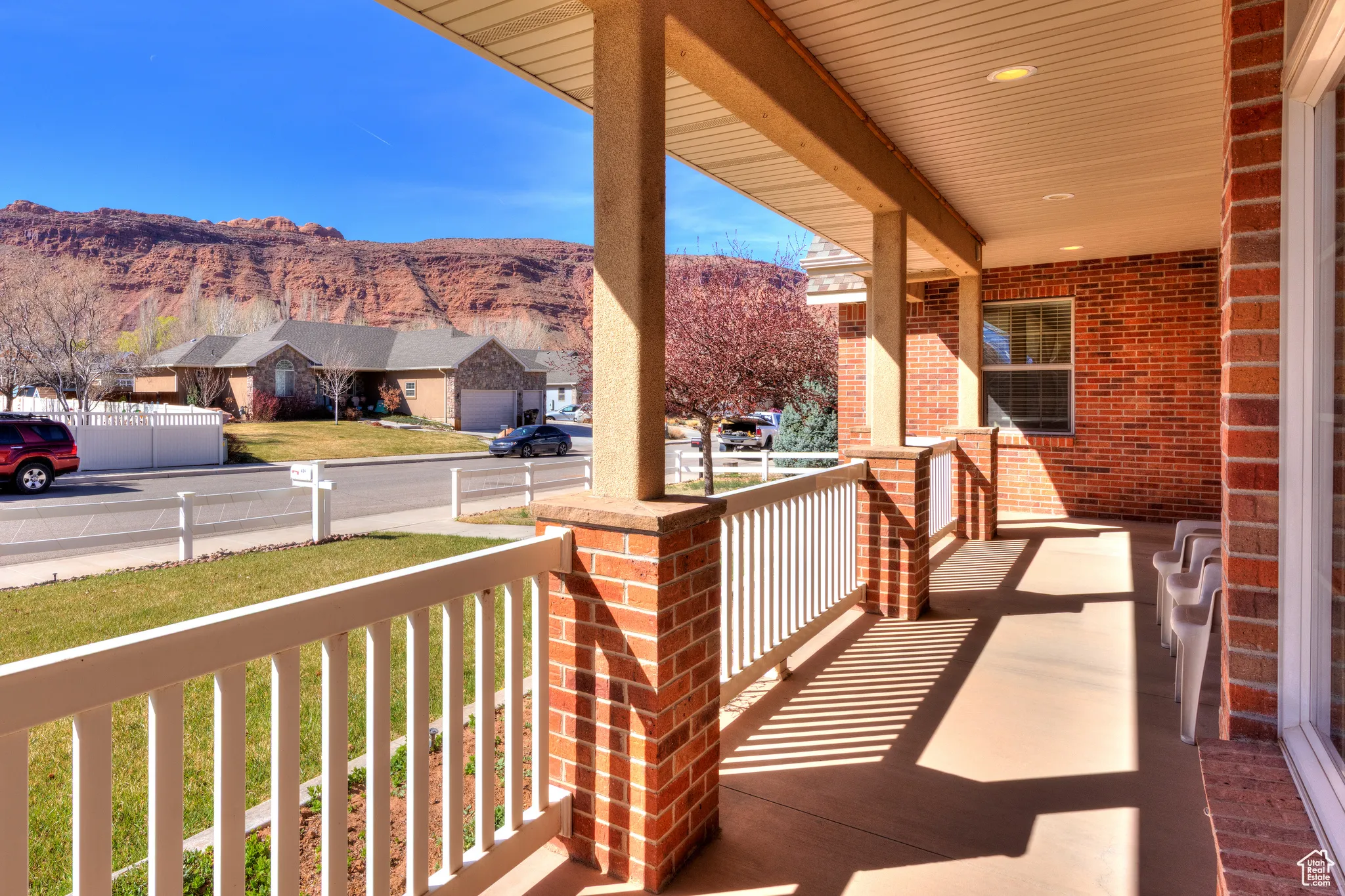 Exterior space featuring covered porch, a mountain view, and a residential view