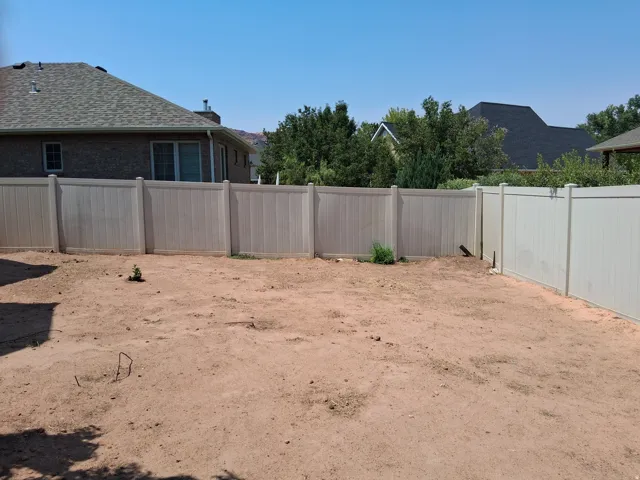 N.W. Corner of yard ready for garden or landscaping with fence in place.