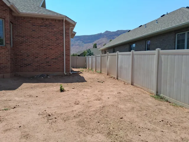 Brick exterior and side yard on North side of house ready for landscaping or garden.