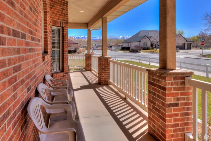 View of patio with a porch and a residential view