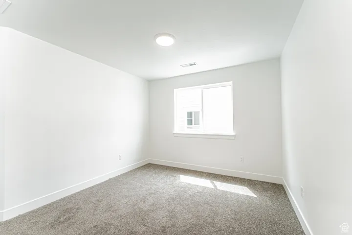Empty room featuring carpet