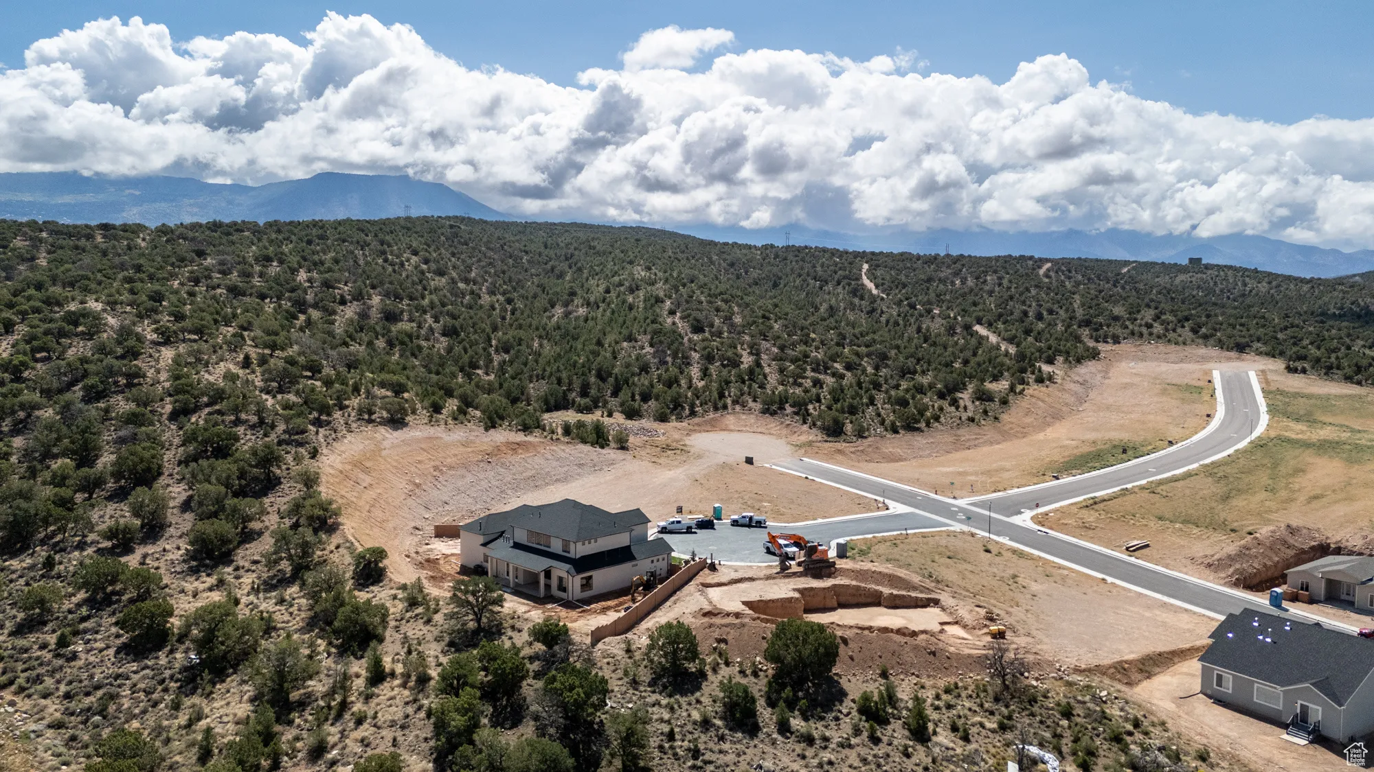 Aerial view of a heavily wooded area and mountains