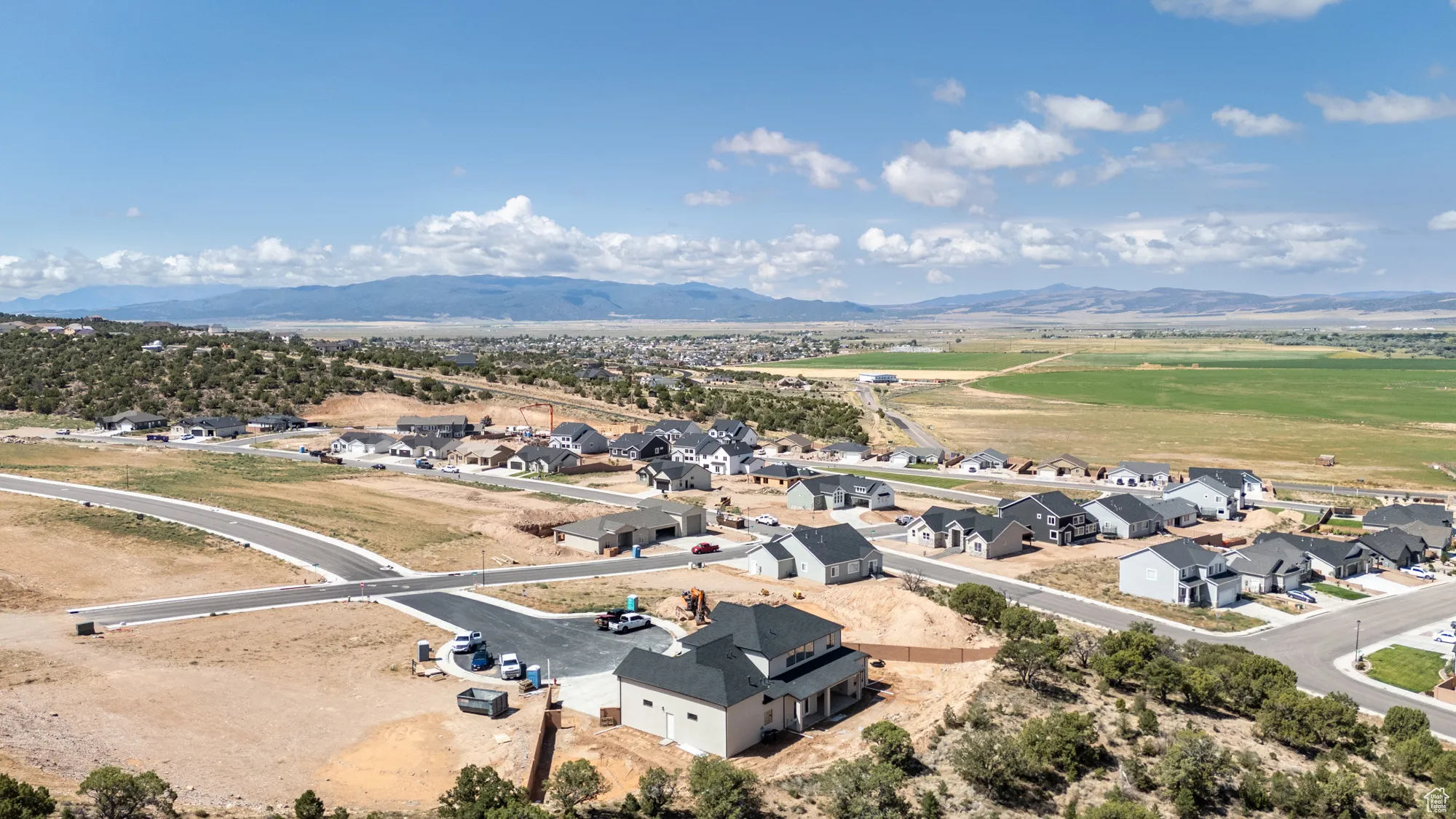 Aerial view of residential area with a mountainous background