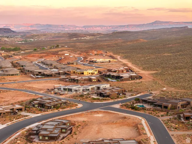 Birds eye view of property with a residential view and a mountain view