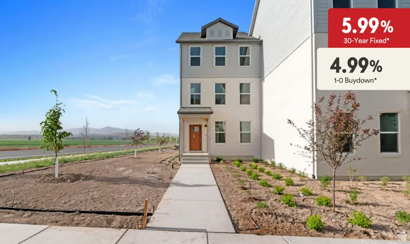 View of front facade featuring a rural view, a mountain view, and stucco siding