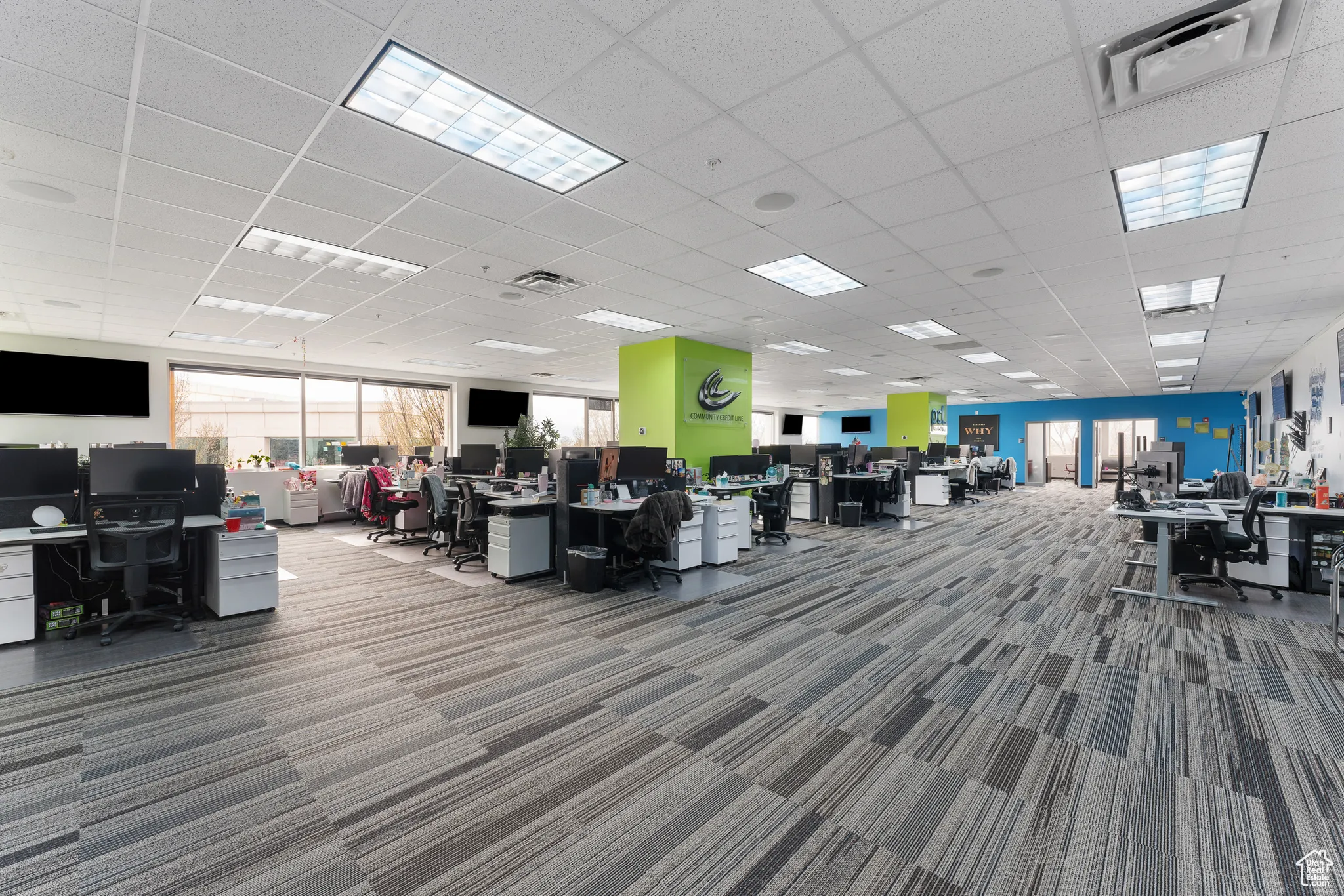 Miscellaneous room with a paneled ceiling, carpet, and visible vents
