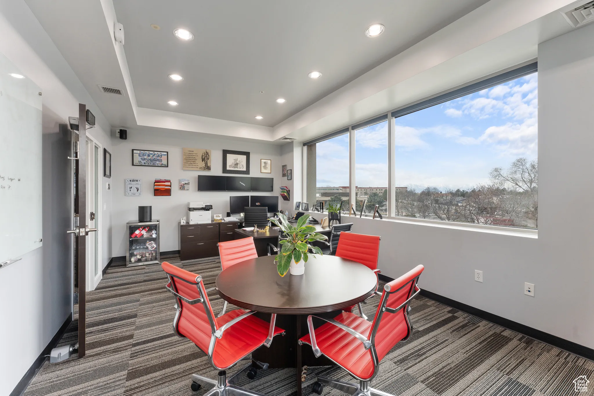 Dining space featuring baseboards, carpet floors, and visible vents