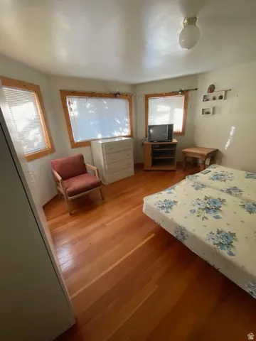 Bedroom with wood finished floors