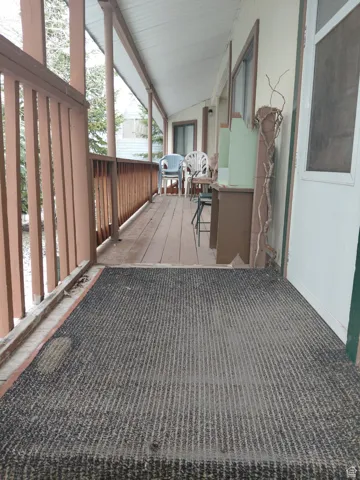 Wooden deck featuring a porch