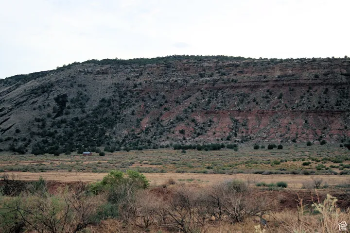 Property view of mountains with a rural view