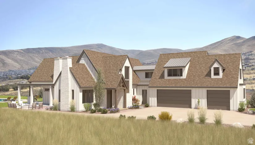 View of front of home featuring concrete driveway, an attached garage, board and batten siding, a mountain view, and a chimney