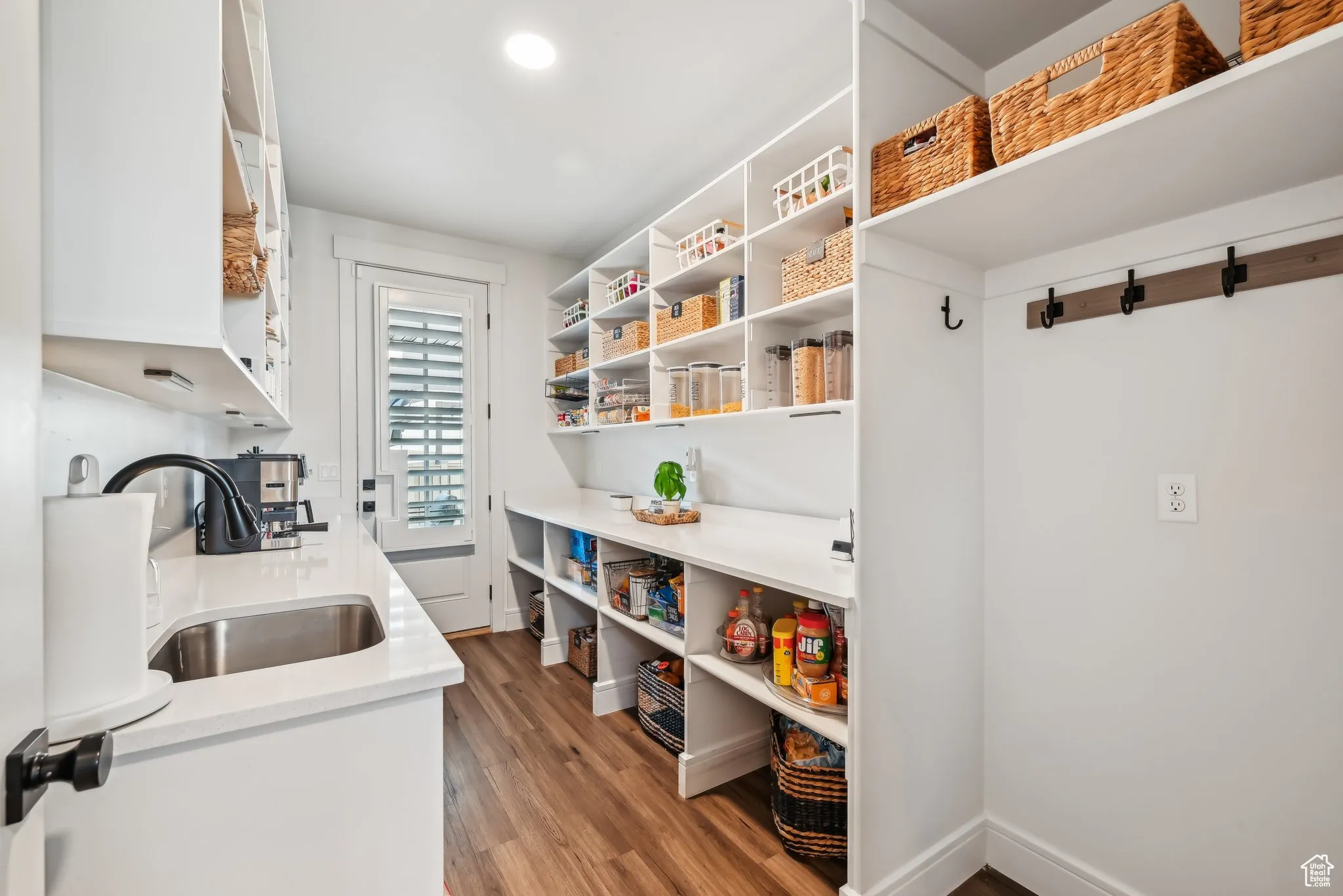 Walk in pantry! Behind the wall of cabinets with the fridge