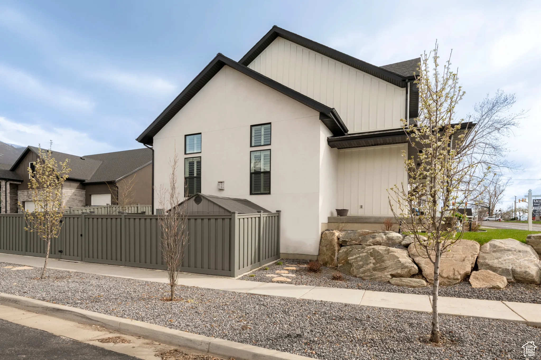 Modern farmhouse with a fenced front yard