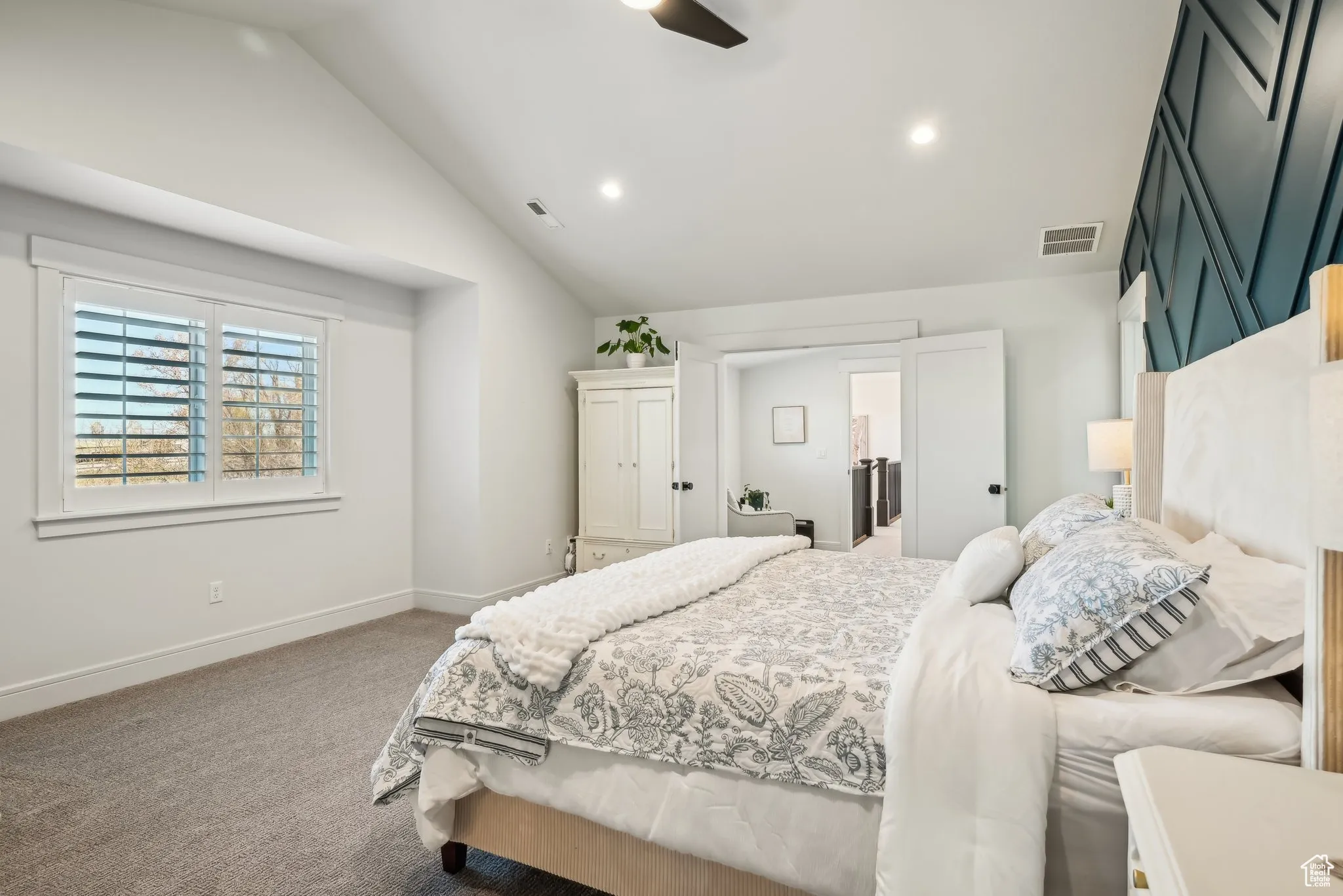 Bedroom with baseboards, recessed lighting, visible vents, lofted ceiling, and carpet