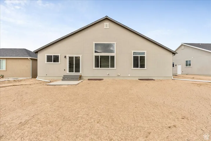 Back of property with entry steps