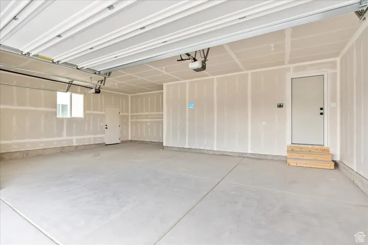 Garage featuring a garage door opener