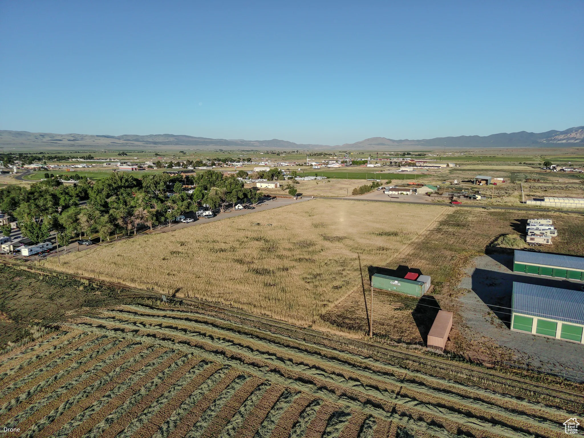 Overview of rural landscape with a mountainous background and extensive farmland