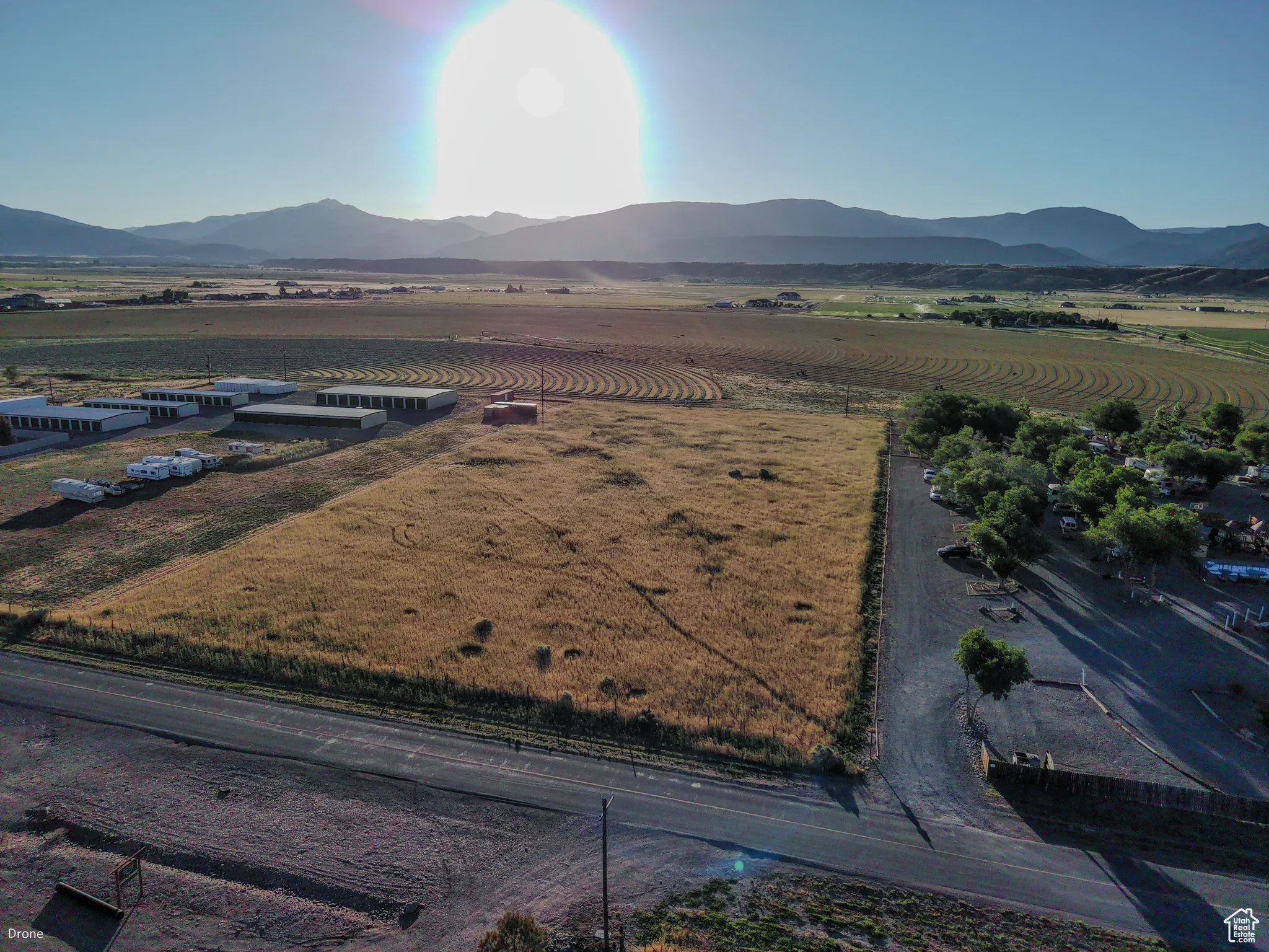 Overview of rural landscape featuring a mountainous background