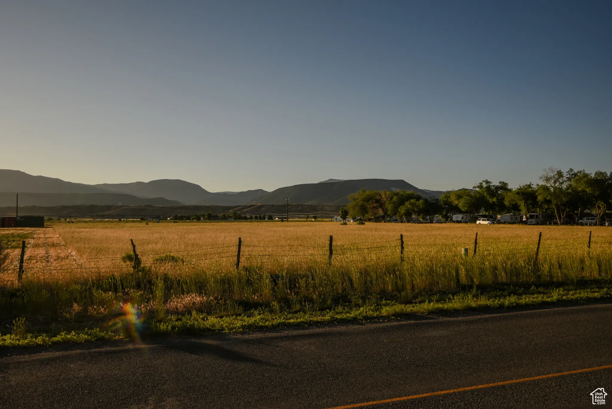 View of mountain backdrop with rural landscape