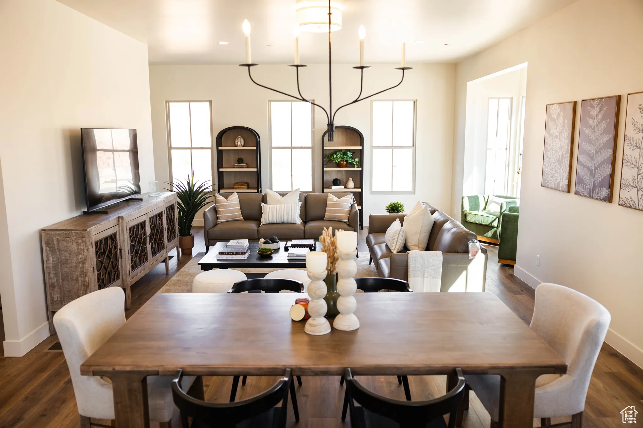 Dining space with baseboards and dark wood-style floors