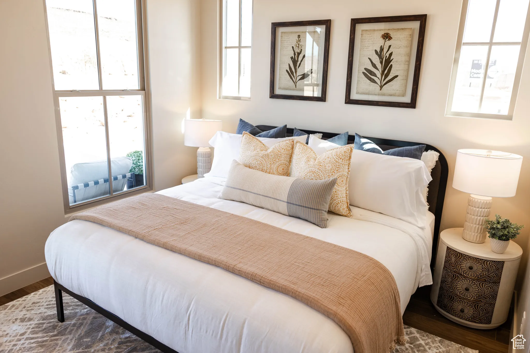 Bedroom with wood finished floors and baseboards