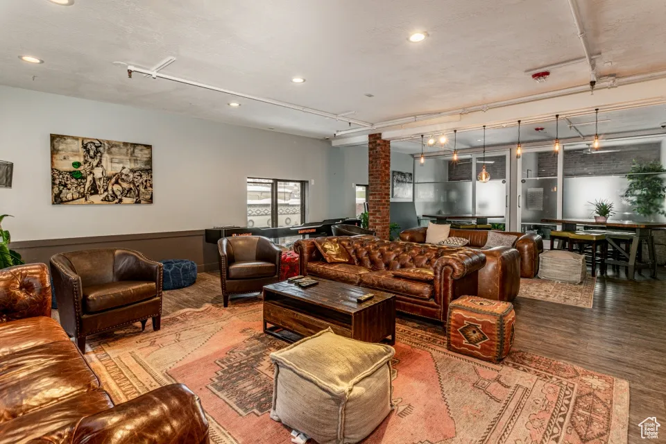 Living area with recessed lighting and wood finished floors