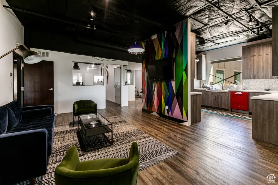 Living room with dark wood-style flooring