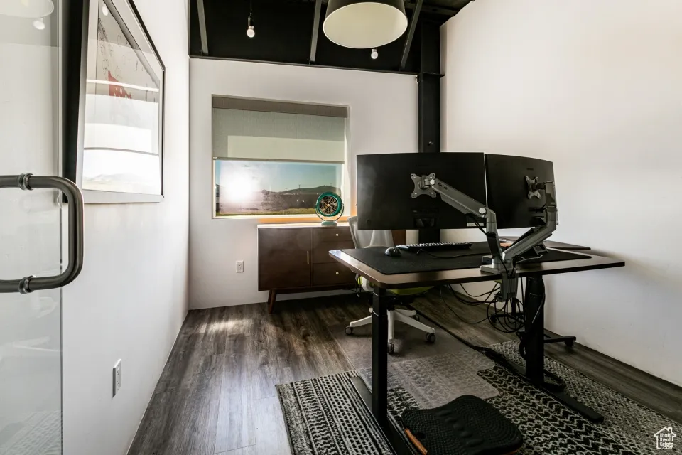 Office with wood finished floors