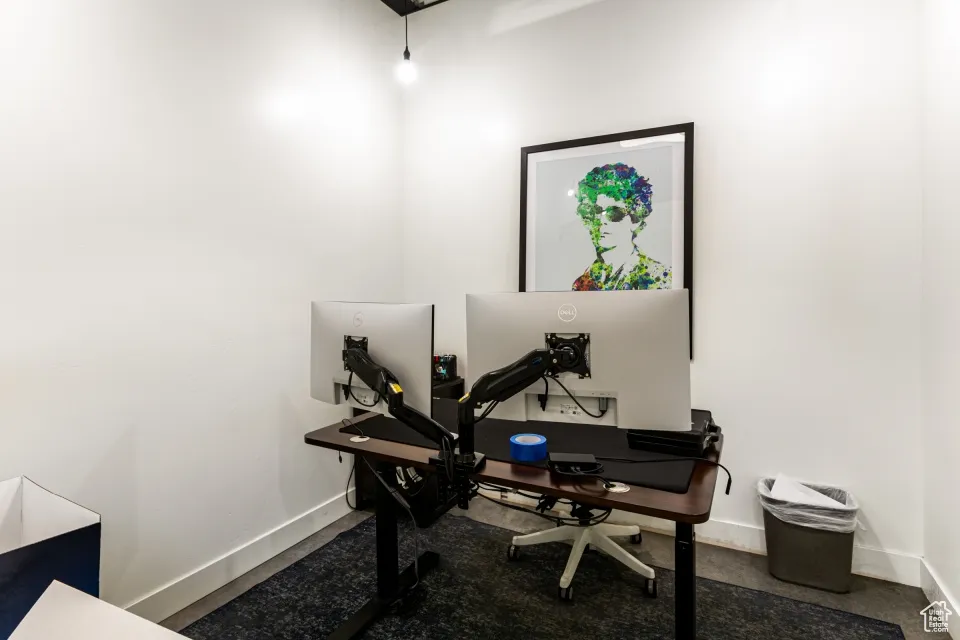 Office area featuring baseboards